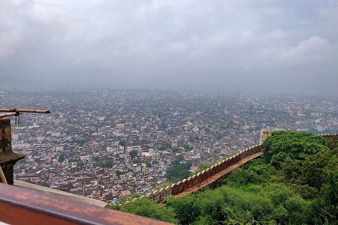 Full–Day Jaipur Sightseeing Tour - Jal Mahal (Water Palace): a red sandstone landmark sitting in Man Sagar Lake