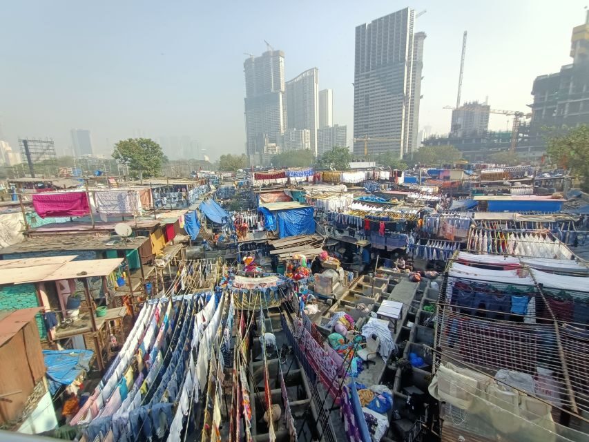 Mumbai: Dhobi Ghat Tour with Dharavi and Train Ride Options - Key highlights worth planning around