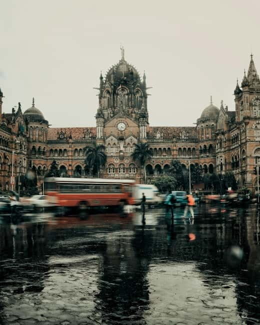 Mumbai: Half-Day City Tour with a Local - Transportation mix: train, rickshaw, and black-yellow taxis
