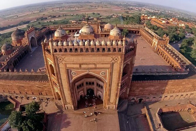 Overnight Sunset & Sunrise Taj Mahal Trip from Delhi includes,Hotel,Guide & Car - Day 1 in Agra: Fort Views, Tomb Stops, and Taj at Sunset