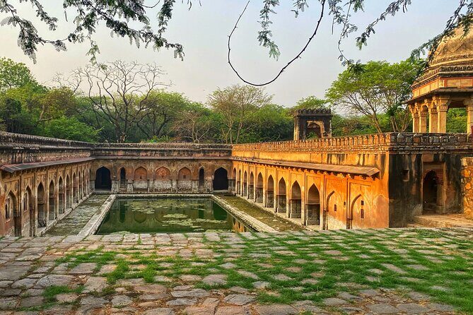 Premium Hidden Jewels of Delhi Cycling Tour - The First Chapter of Delhi - Qutub complex and Mehrauli: honey-stoned monuments on two wheels