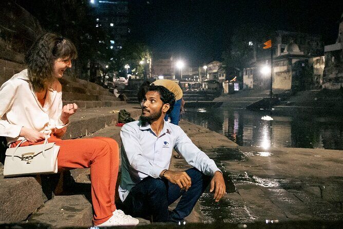 Private Mumbai Night Tour - Antilia: street-level contrast between street life and billionaire scale